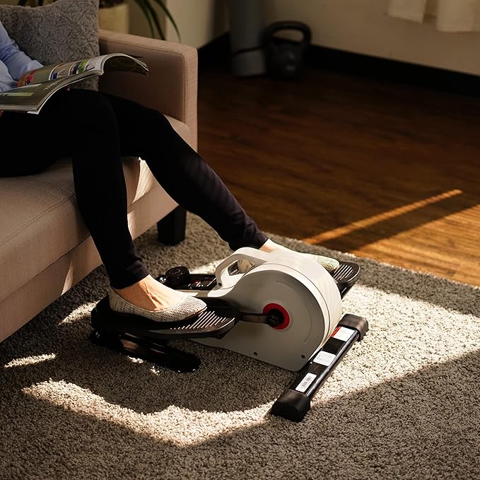 Sunny Health & Fitness Under Desk Pedal Elliptical Machine, Adjustable Resistance Leg Exerciser Home Workout While Sitting for Seniors, Optional Motorize or in Pink with SunnyFit App via Bluetooth